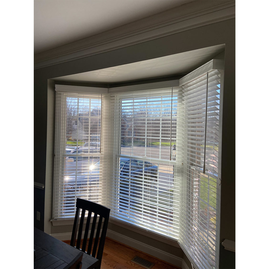 Norman 2 inch faux wood blinds on a bay window, with custom installed continuous valance. Haymarket, VA