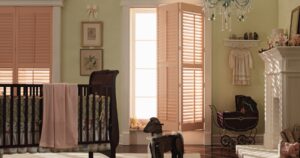 Plantation shutters add a touch of sophistication and charm to a baby nursery.
