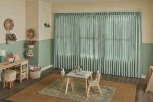 Drapes offer a soft and elegant touch to the nursery